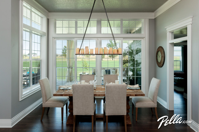 Dining room with wall to wall Pella Windows