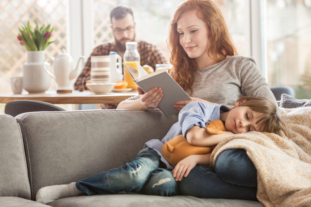 a happy family in a living room of their energy efficient home