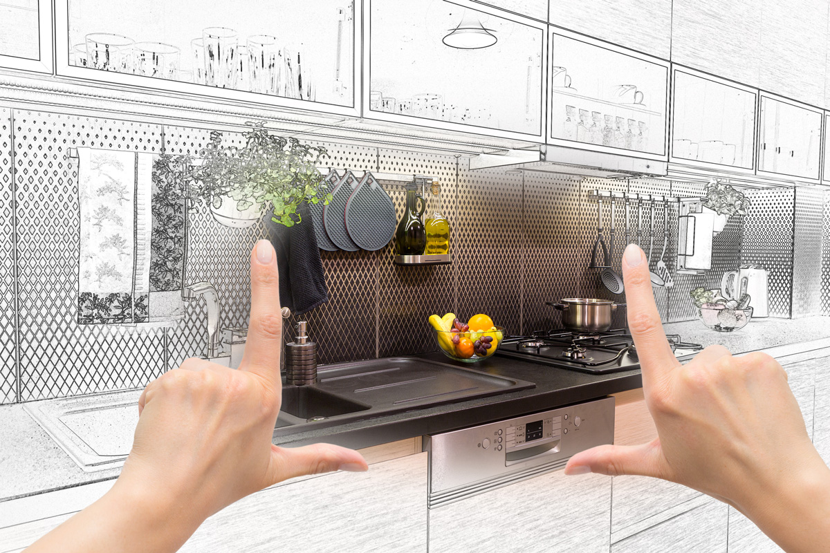 A graphic kitchen with a person’s hands in front of it in El Paso.